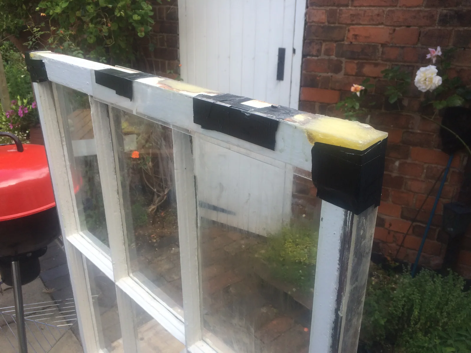 Georgian sash window reassembled after repair